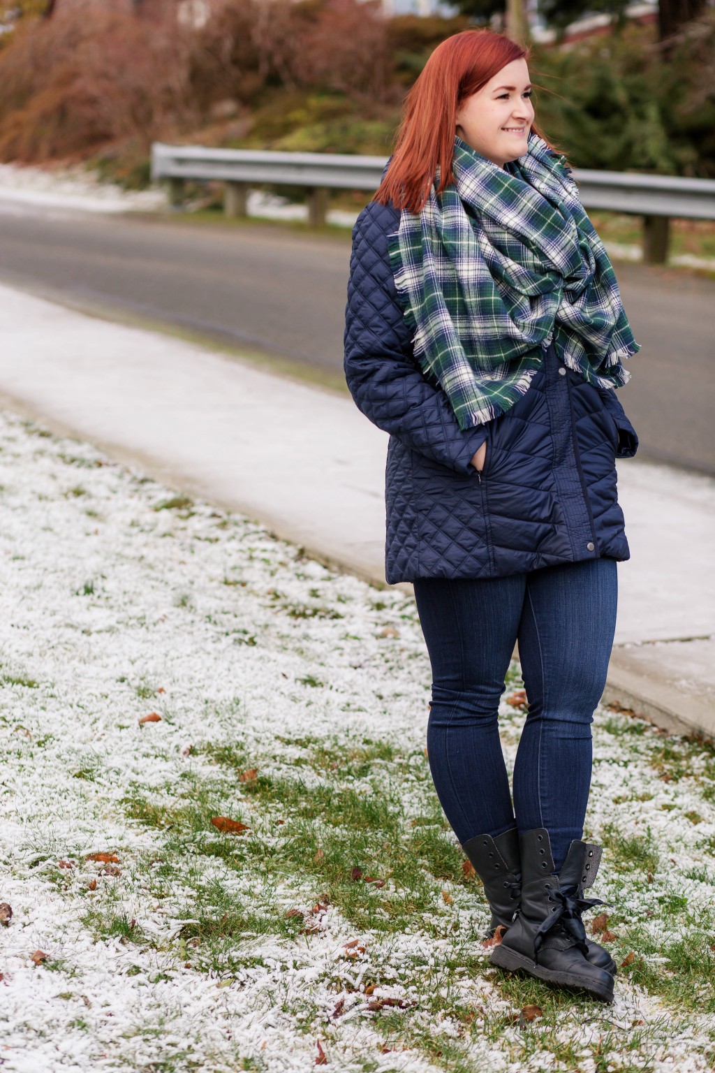 Navy blue puff coat, blue and green plaid blanket scarf